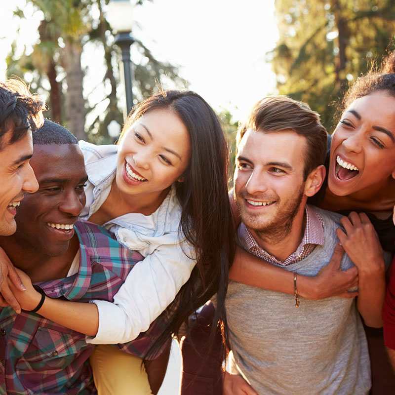 young-woman-holding-aligners young woman holding aligners